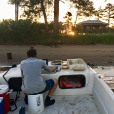 Researcher Jack Buchanan measures a seine catch on the York River. © Jordan Wheatley/VIMS.