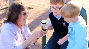 VIMS professor Deborah Steinberg shares an anglerfish specimen with contest winner Johnny Vaughan and his brother Morgan.