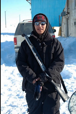 An Inupiat native named Roxie helps guard against polar bears.