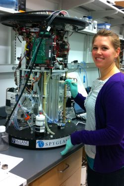 Smith works on the Environmental Sample Processor in the lab. Photo by Mengmeng Tong.