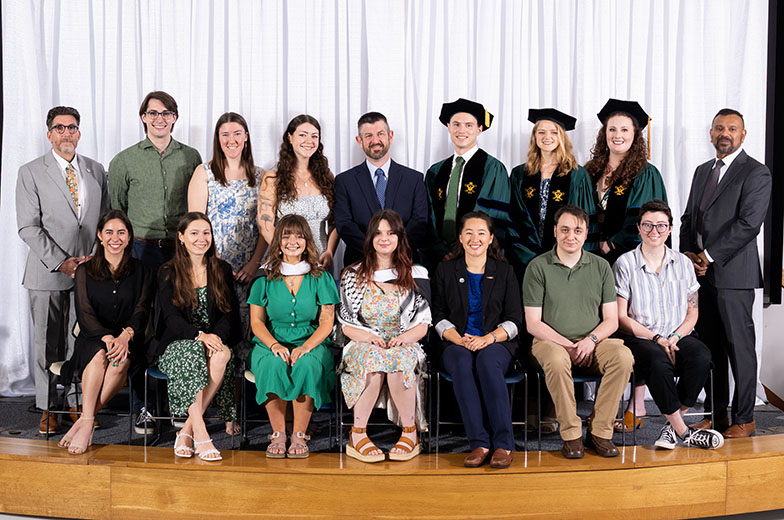 W&M School of Marine Science graduates pose for a picture at their Diploma Ceremony.